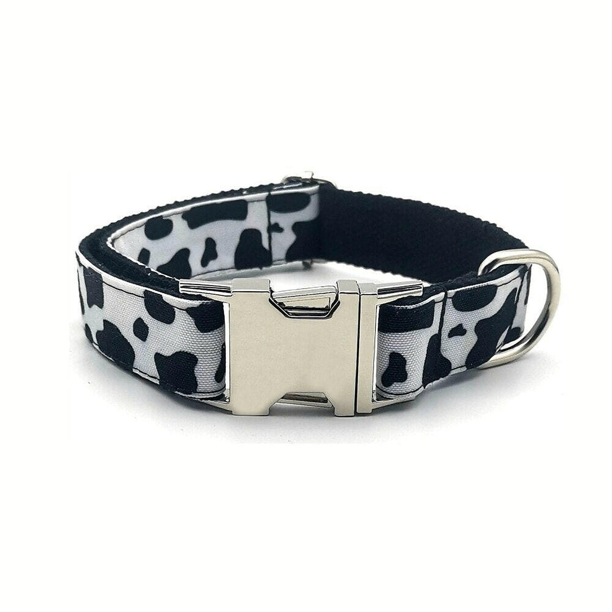 Cowhide Couture dog collar in black-and-white cow print with silver-tone buckle.